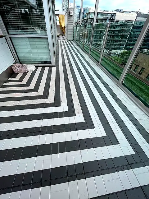 The terrace floor painted in a black and white chevron stripe pattern
